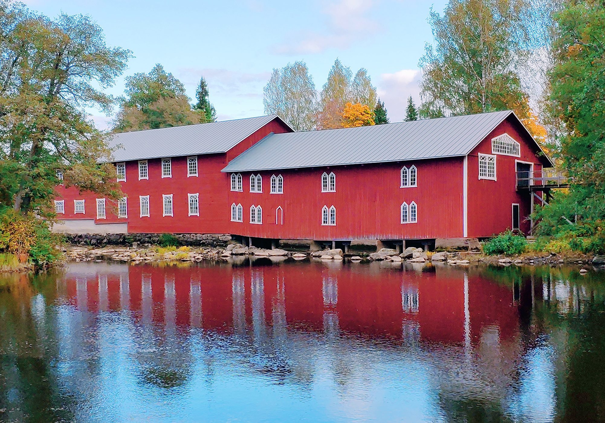 Red building by the water.