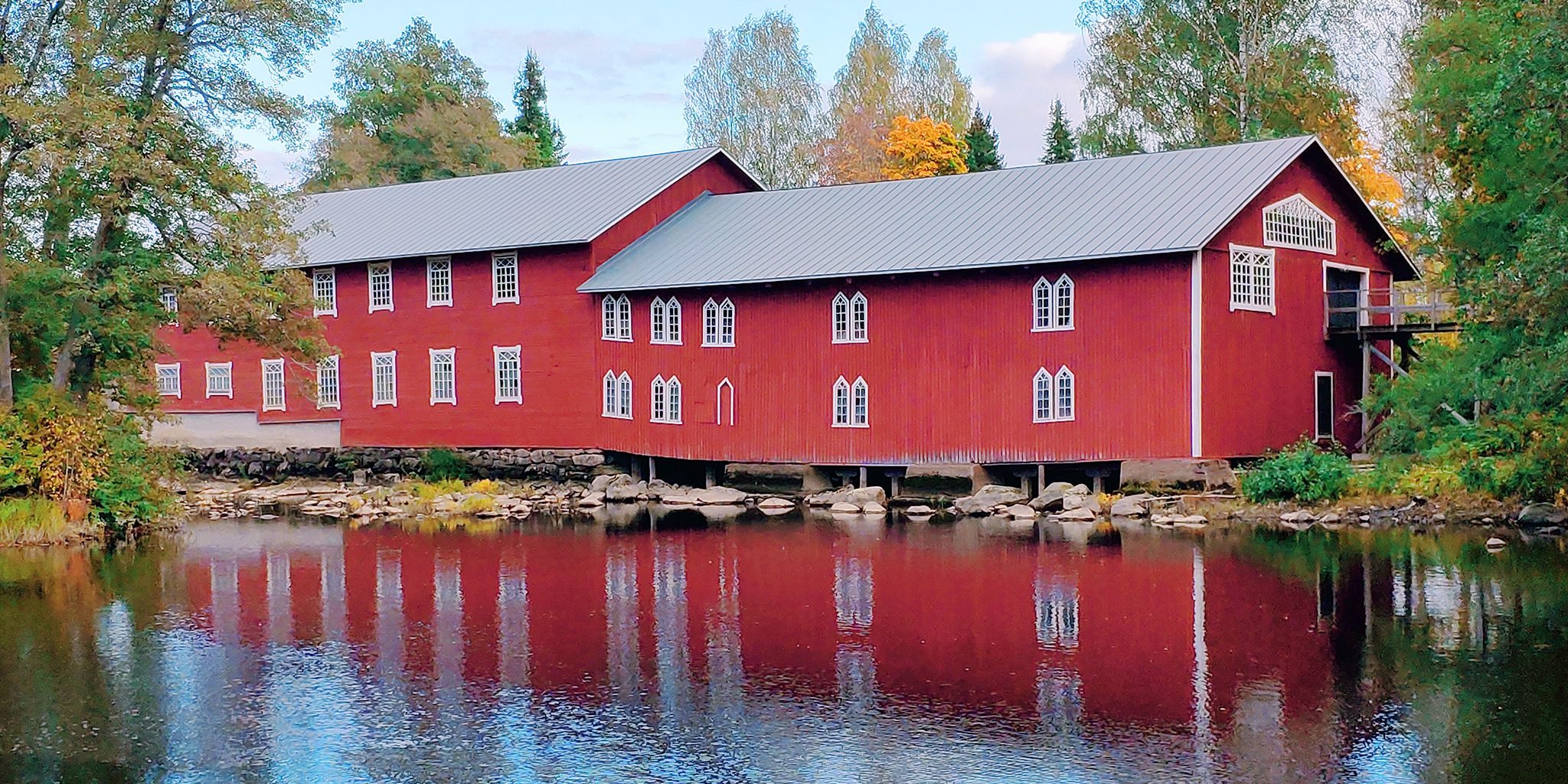 Red building by the water.