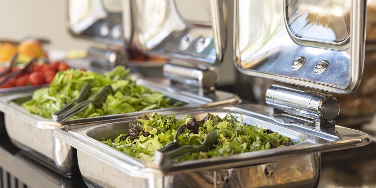 Picture of a salad in a buffet line.